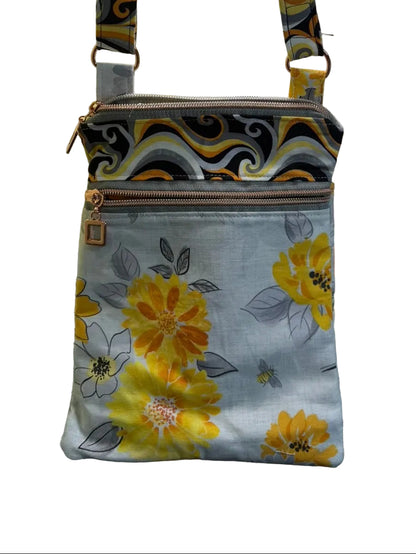 Floral-patterned bag with a strap