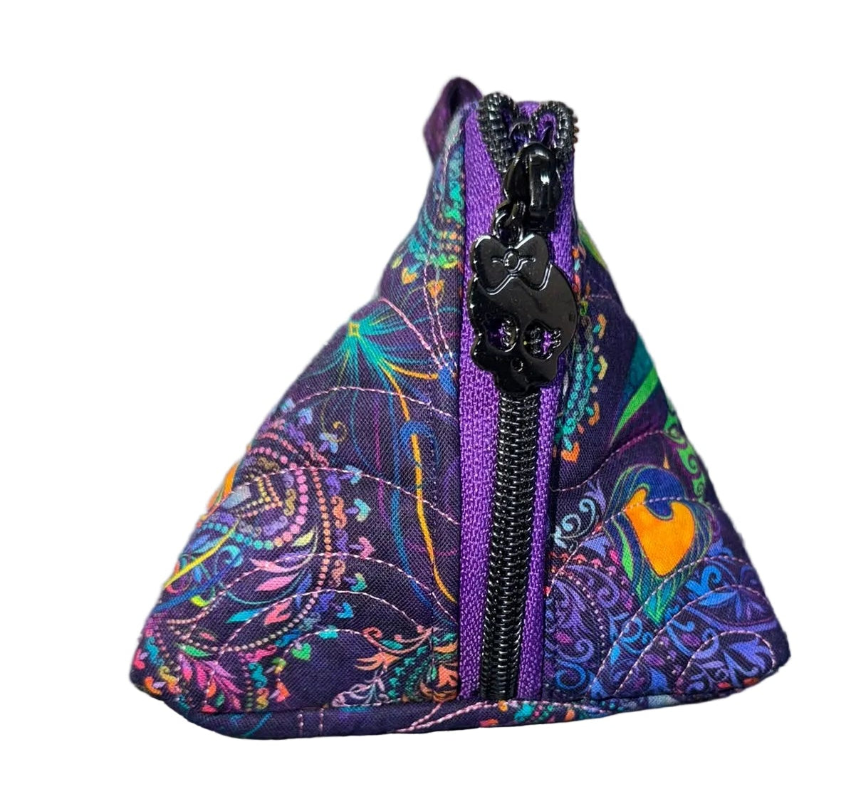 A small triangular fabric zip pouch with a purple and multicolor mandala pattern, standing upright.