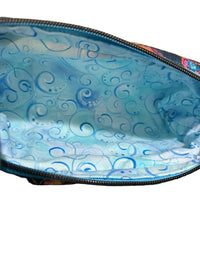 Close-up of the inside of a zippered pouch or bag, showing a blue and light blue swirl patterned lining.