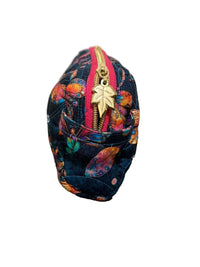 A medium fabric zippered pouch with a colorful butterfly pattern on a dark navy background, featuring a gold metal zipper pull shaped like a leaf,.