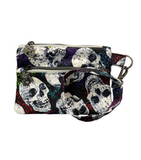A small zip pouch with a black, white, and red skull pattern and colorful accents, 