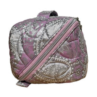 Side view of the handmade quilted Haven Pouch in Frosted Orchid with silver paisley print and wrap-around zipper
