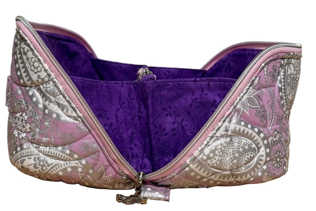 Haven Pouch in Frosted Orchid with the wrap-around zipper opened wide to show the purple vine-print interior