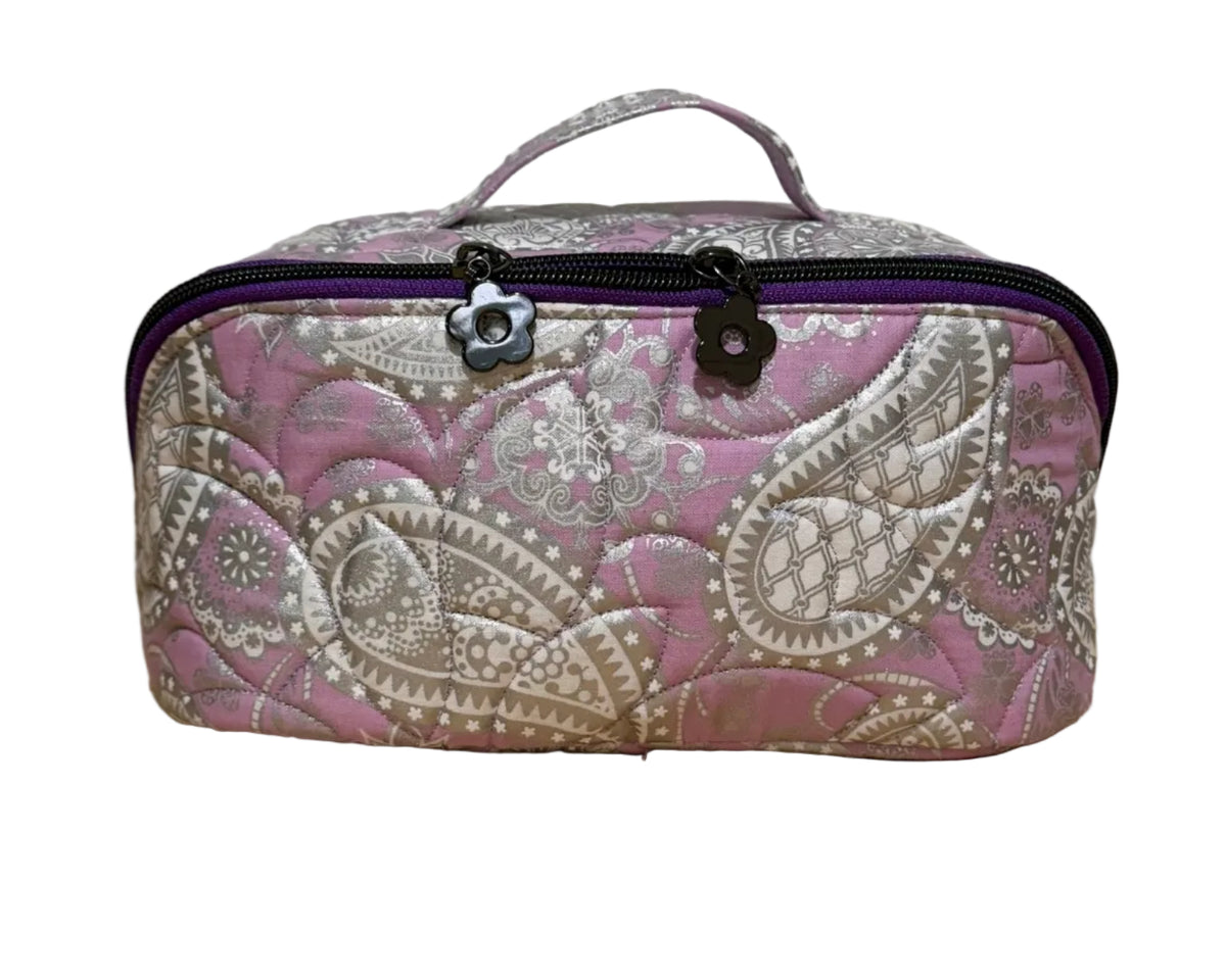 Front of the Haven Pouch in Frosted Orchid, a handmade quilted pouch with pink and lavender silver paisley fabric and top handle