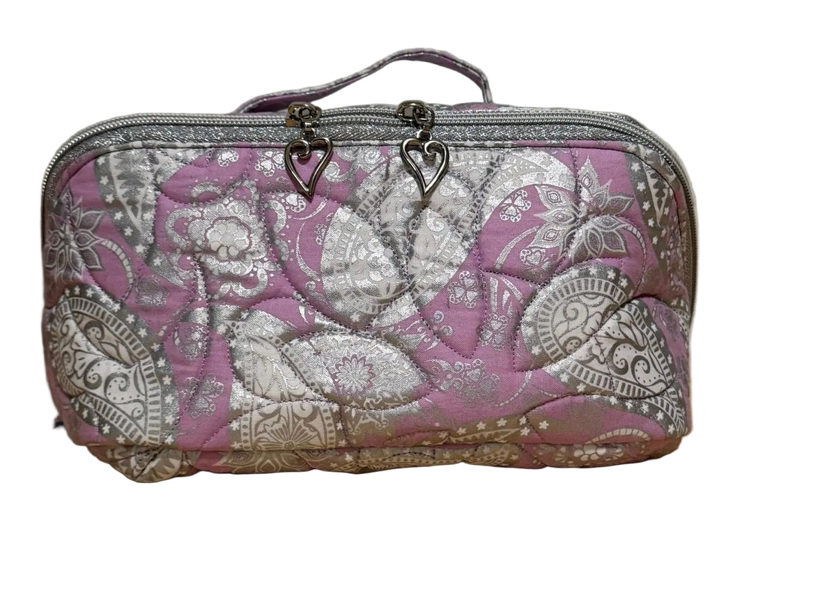 Front of the Haven Pouch in Frosted Orchid, a handmade quilted pouch with pink and lavender silver paisley fabric and top handle