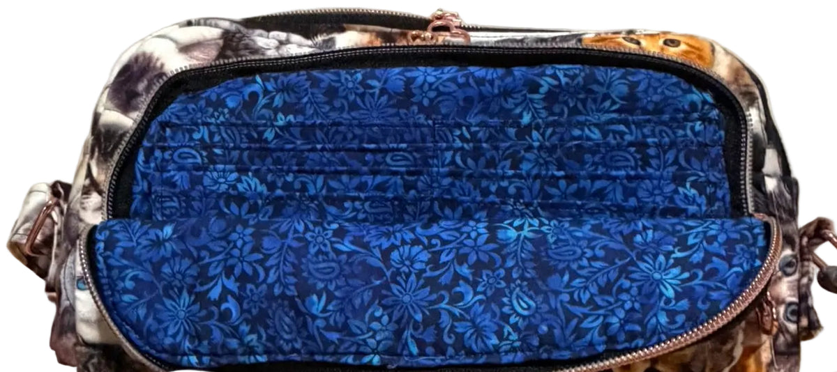 Kitten Cuddle Vibe XL Bag with the front pocket open to show the blue floral lining and card slots