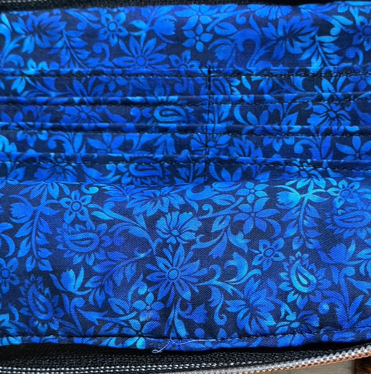 Kitten Cuddle Vibe XL Bag with the front pocket open to show the blue floral lining and card slots