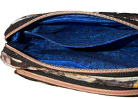 Inside of the Kitten Cuddle Vibe XL Bag showing the blue floral lining and zip compartments