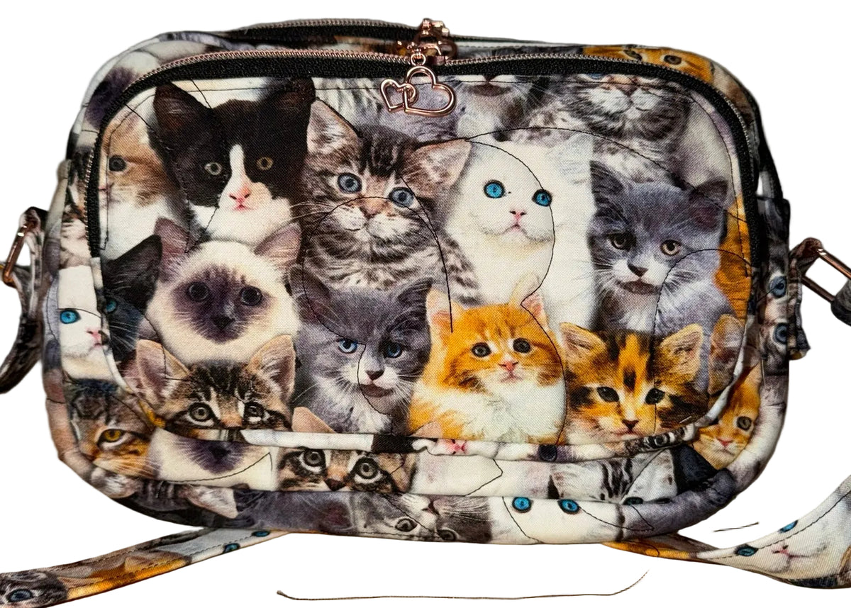 Kitten Cuddle Vibe XL crossbody bag with its adjustable strap in quilted kitten fabric