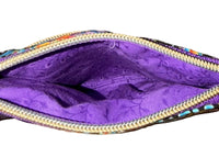 Inside of the Carnival Swirl Swing Bag Mini showing the bright purple lining