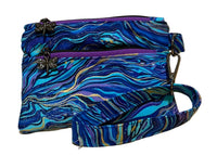 Handmade Gilded Tide Swing Mini wristlet in blue, teal, and purple marble fabric with gold veins, front view