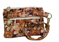 Rust Blossom Swing Mini wristlet with a wrist strap in warm autumn floral fabric