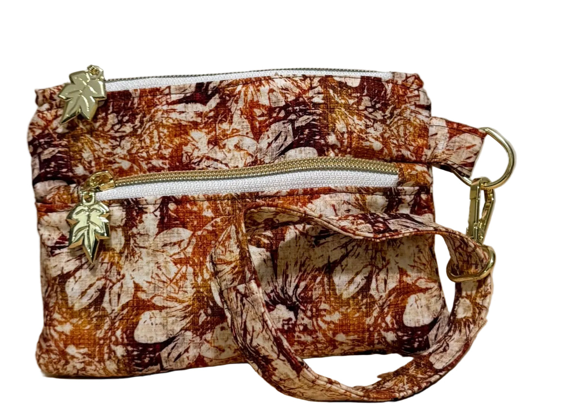 Rust Blossom Swing Mini wristlet with a wrist strap in warm autumn floral fabric