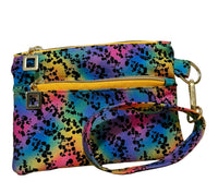 Rainbow Riot Swing Bag Mini wristlet with two front zip compartments and a wrist strap in rainbow splatter fabric