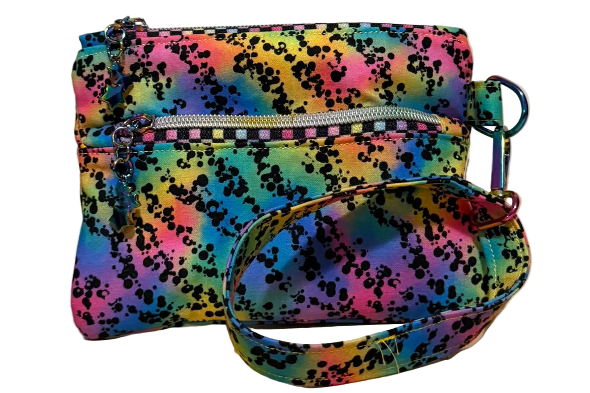 Rainbow Riot Swing Mini wristlet with double zip compartments and a wrist strap in colorful splatter fabric