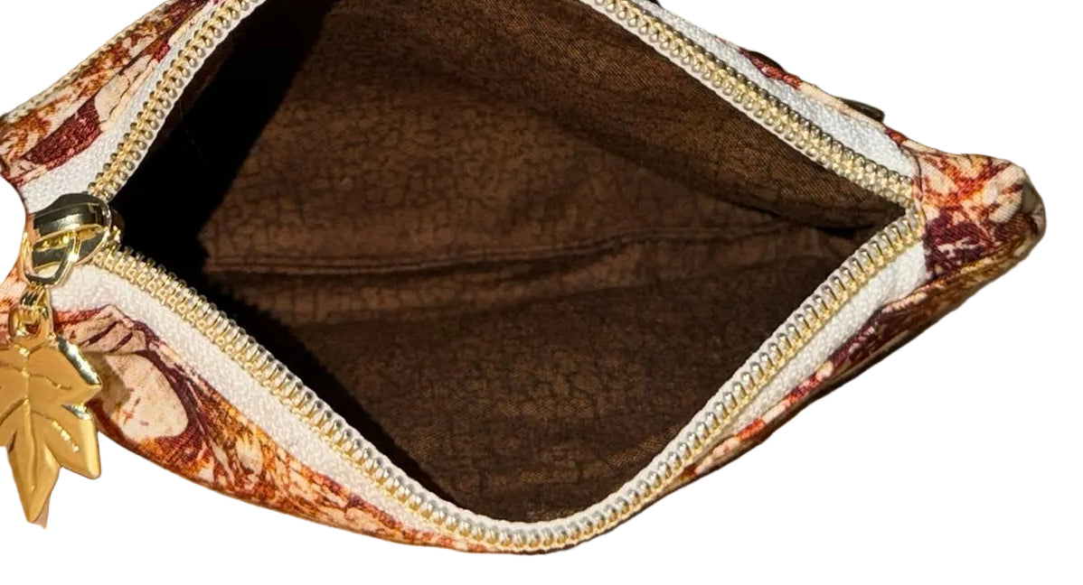 Inside of the Rust Blossom Swing Bag Mini showing the brown lining and open zip compartment